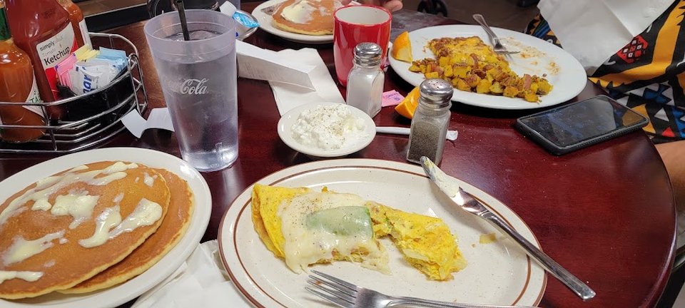Cafe menu with beverages, desserts, and comfort food.