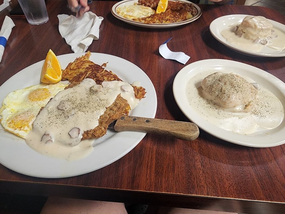 Printed menu showing breakfast, lunch, and dinner choices.
