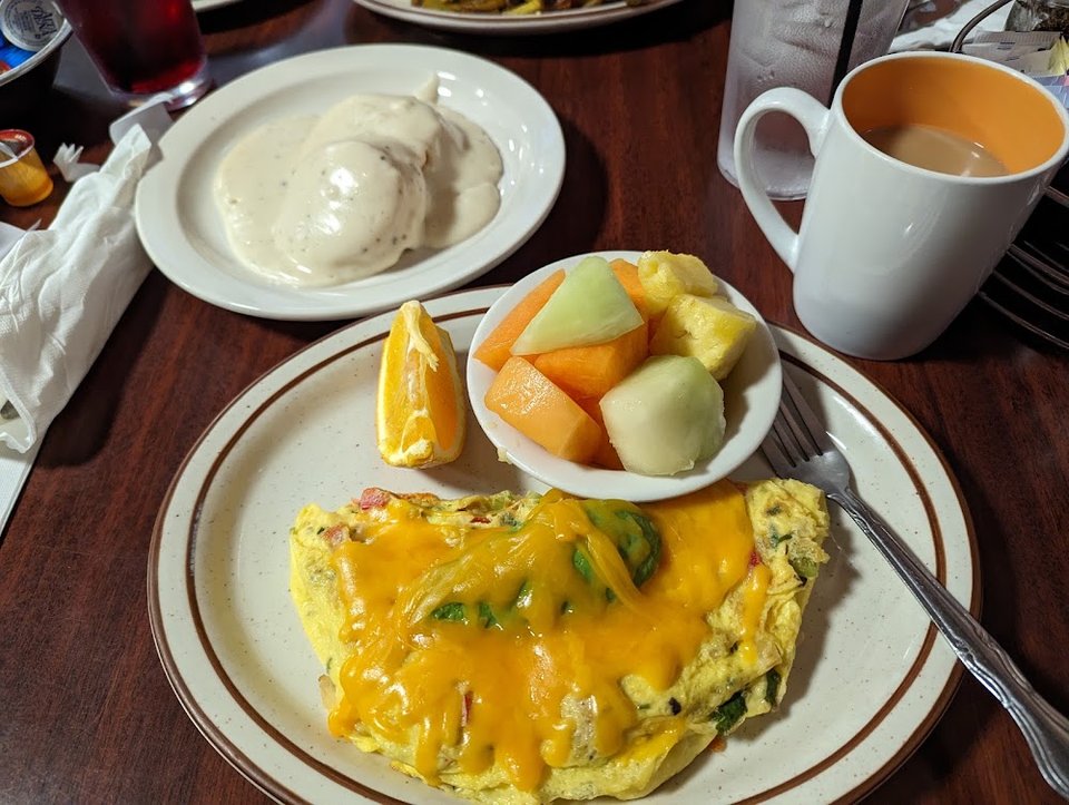Printed menu showing breakfast, lunch, and dinner choices.